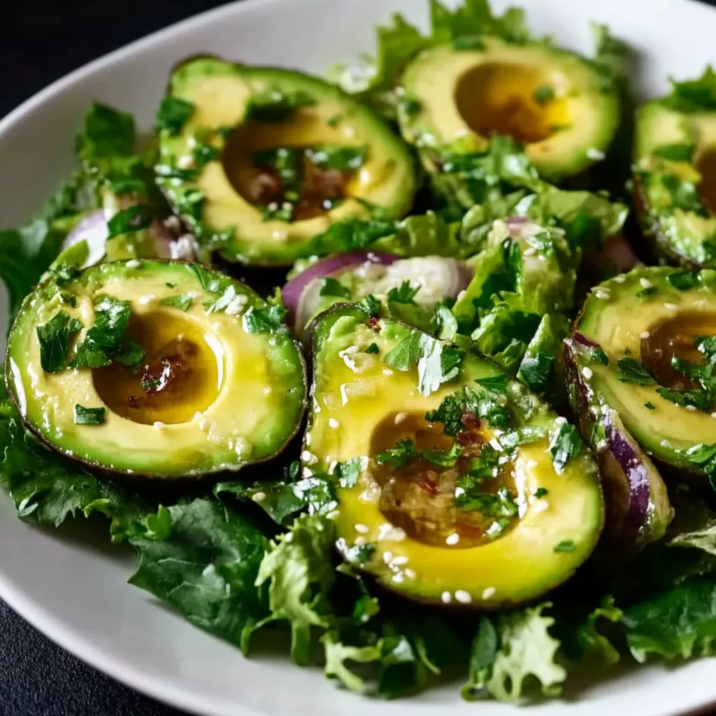 A plate of food with avocado and lettuce.