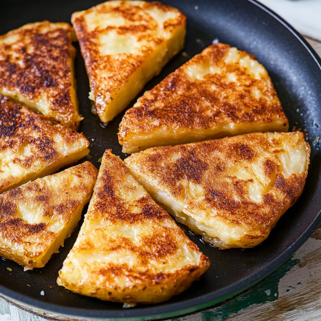 A pan of food with a slice missing.