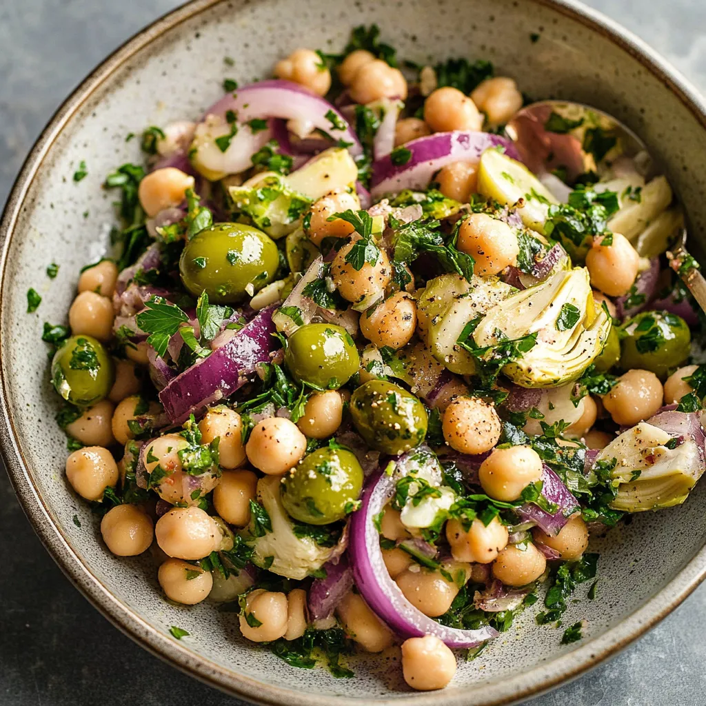 A bowl of food with green beans, onions, and chickpeas.