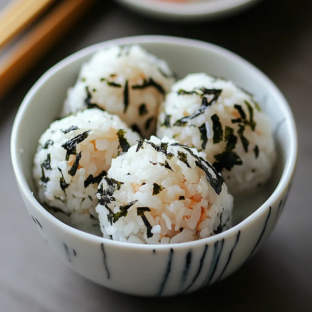 A bowl of rice with seaweed on top.