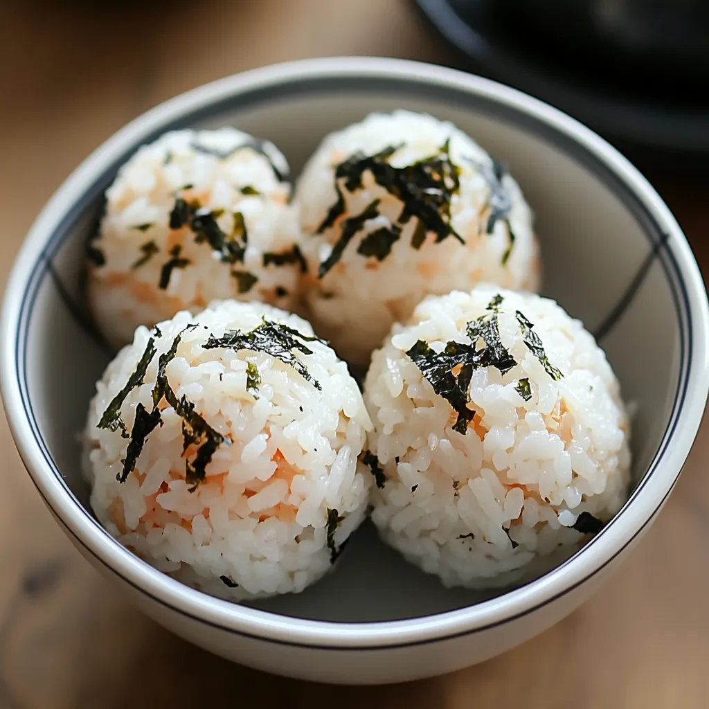 A bowl of rice with seaweed on top.