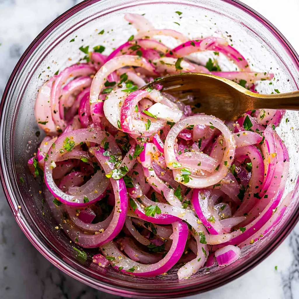 A bowl of onions with a fork in it.